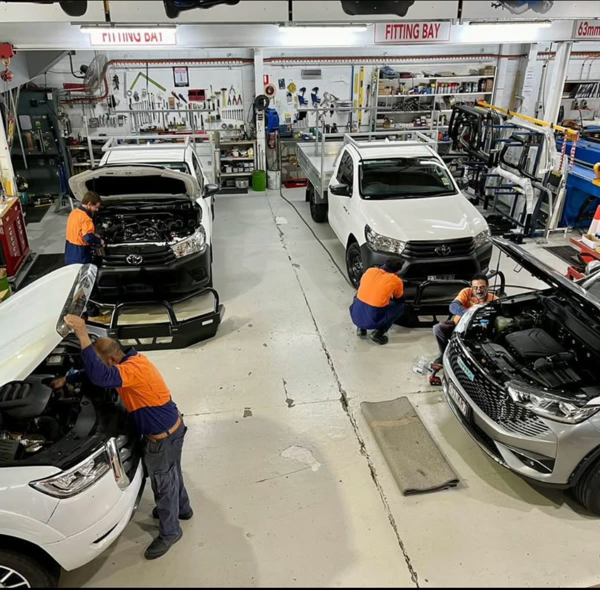 AllBars fitting bay with several vehicles being fitted out