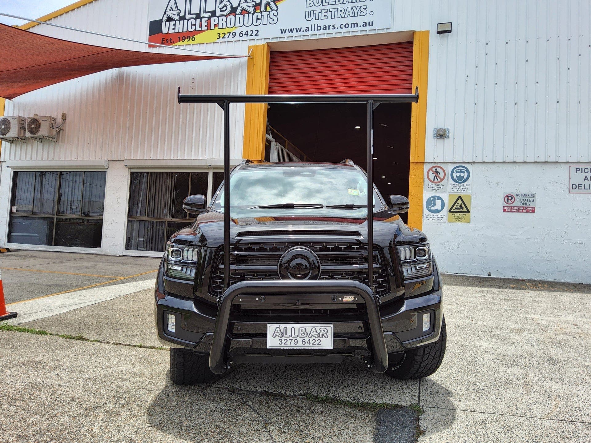 Black ute with AllBars bullbar and H-rack