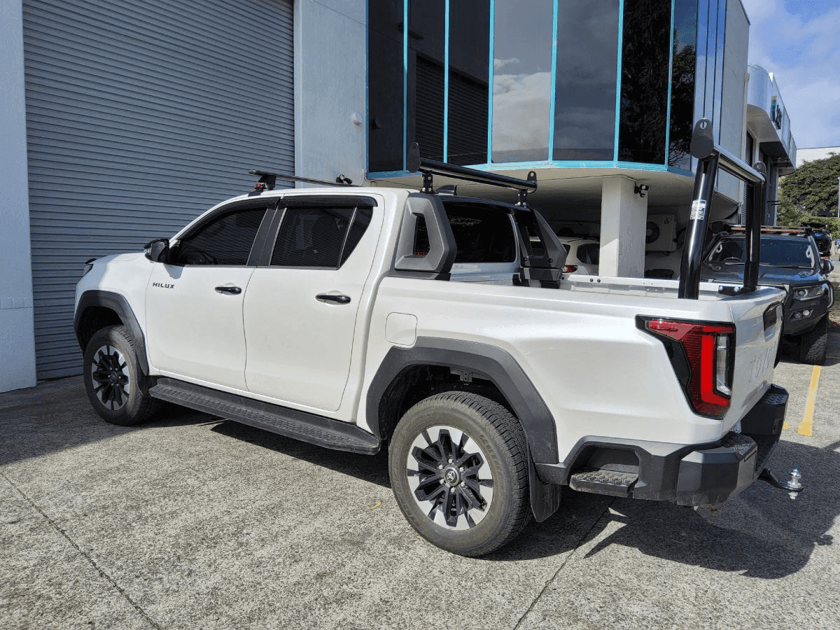 Toyota HiLux with AllBars black trade racks at the Brisbane workshop